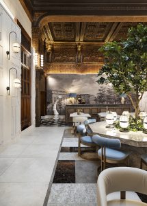 Restaurante en Casa Decor con barra en superficie cerámica Sapienstone efecto piedra y diseño contemporáneo con madera