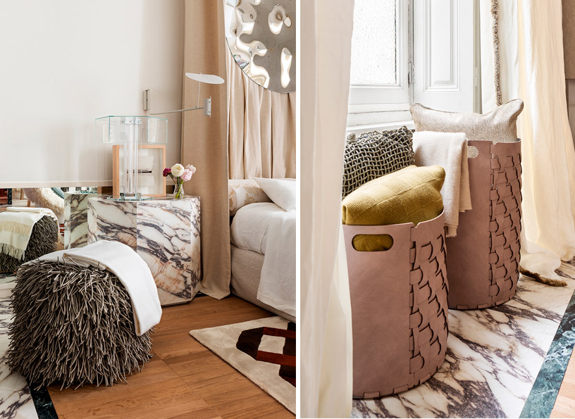 Mesilla de mármol y puff de pelo largo Covo junto a cama con textiles de lino Genix Home en suite de interiorismo italiano